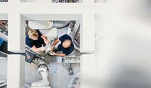 Engineers work with their manufacturing equipment with leasing with Florian Gap Trust